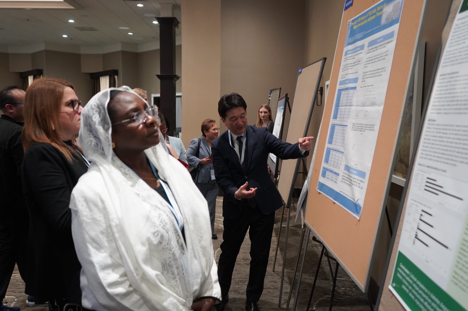 Researchers around a poster
